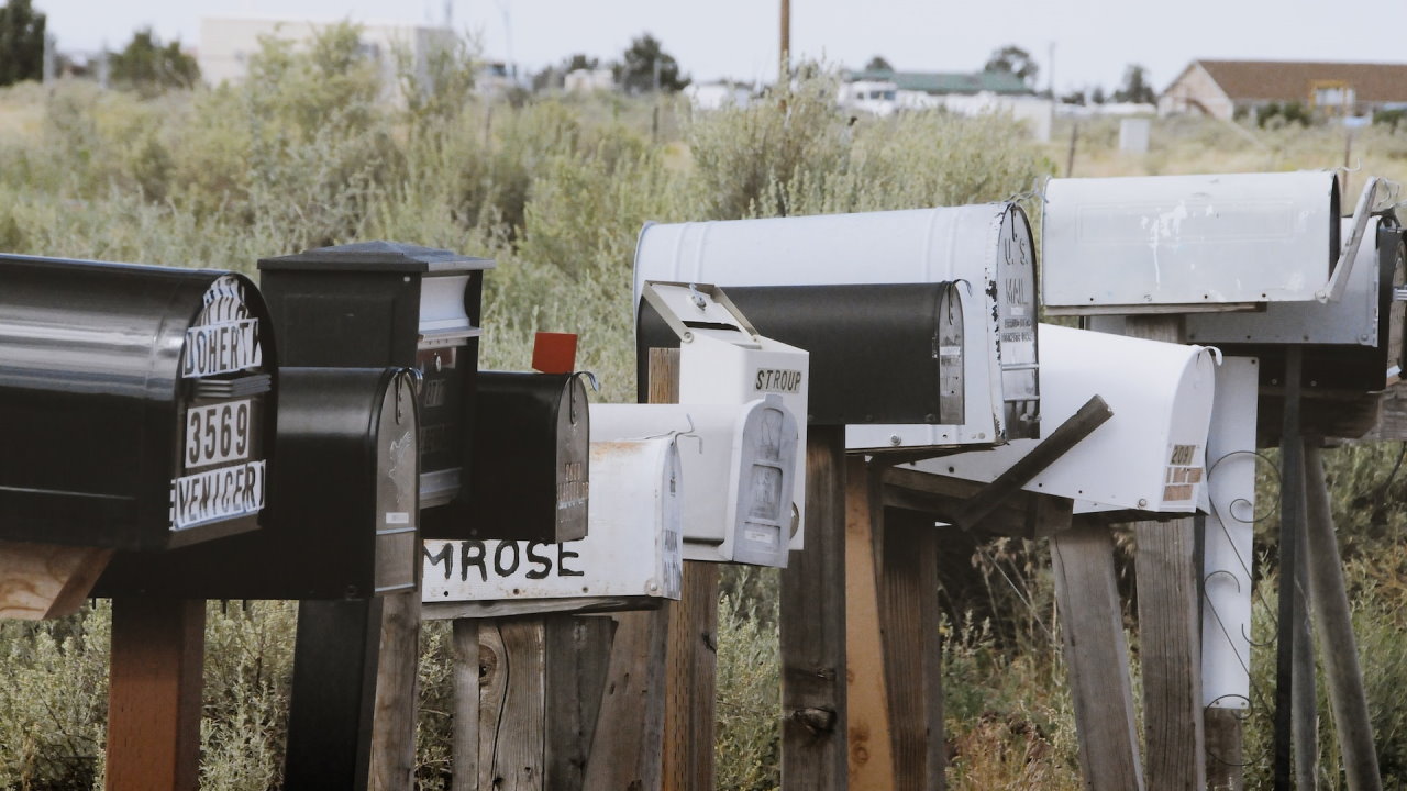 A row of dilapidated mail boxes