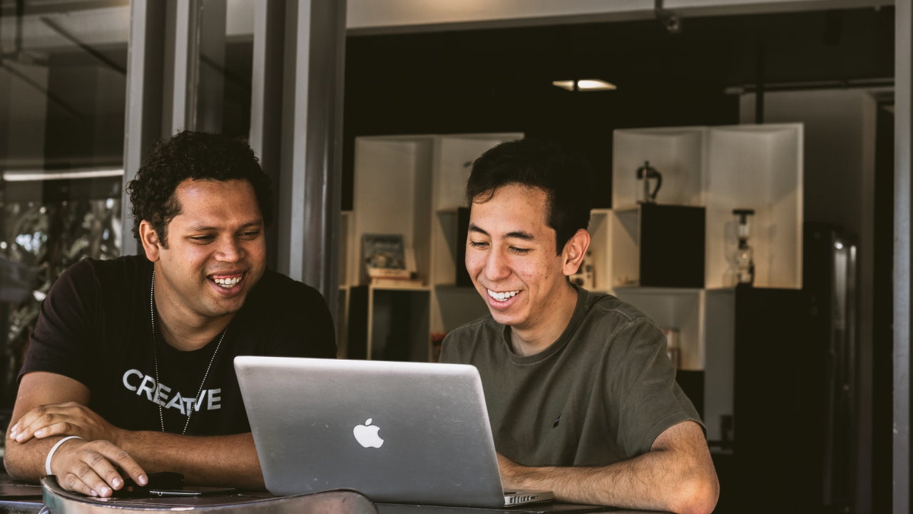 Two men at a laptop